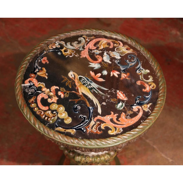 A colorful example of Italian Baroque-inspired craftsmanship, this antique pedestal side table combines a richly carved...