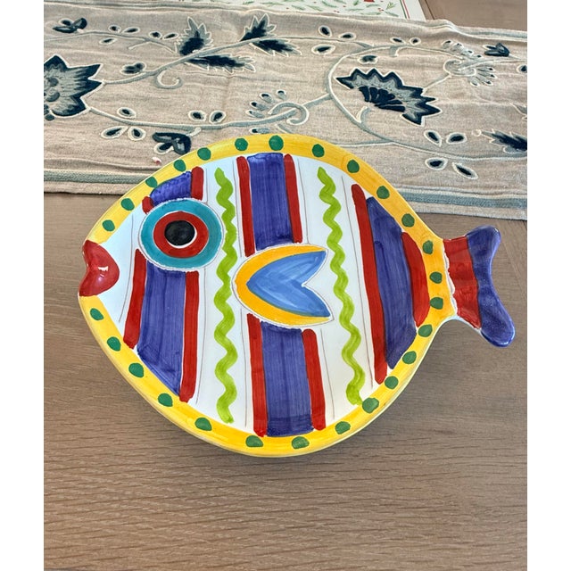 Colorful italian plate in the shape of a fish. Made by the master pottery house Vietri. Blues, greens, reds and yellow...
