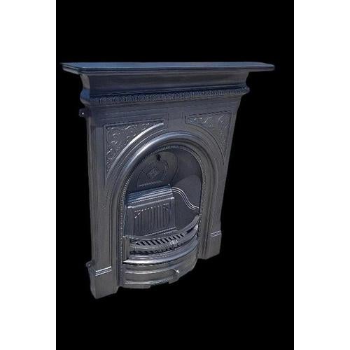 A striking reproduction cast iron arched combination fireplace, designed in the Victorian style and richly embellished...