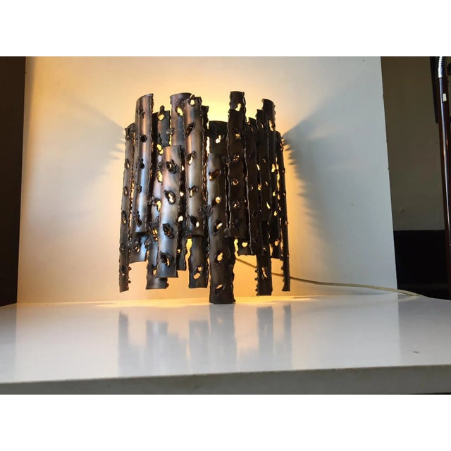 Unique Brutalist Sconce designed anonymously in Denmark during the 1960s. Heavy stock architecturally shaped Bronze or...