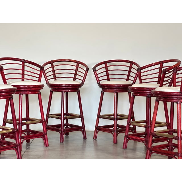 Pair of swivel bar stools from the 1970s produced by the Italian company Rattan Wood, bamboo frame, leather bindings,...