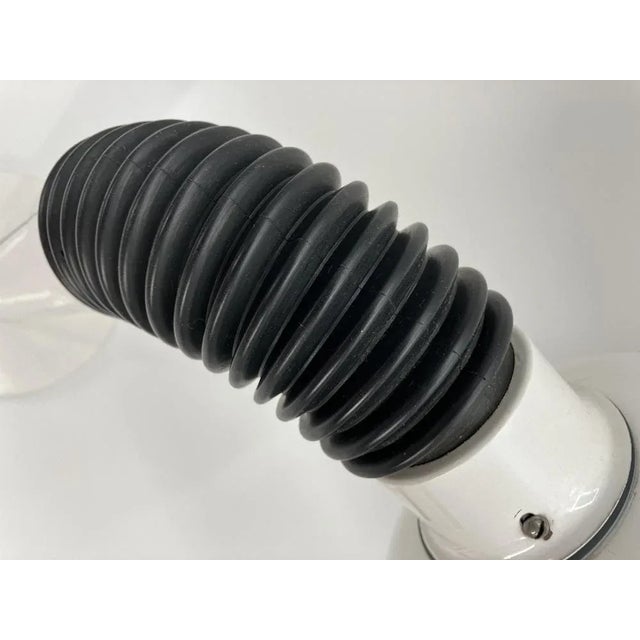 A table lamp * from Italy * Typical space-called design * around 1970 * white lacquered metal screen with striking slots...