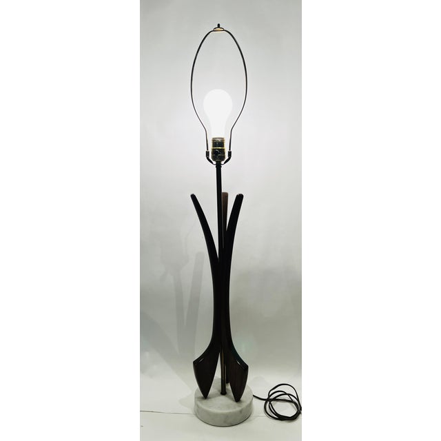 This is a fabulous mid-century modern sculptural walnut and brass table lamp. It has a marble base, will bring a wow...