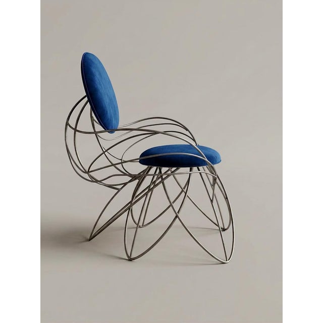 Linea Chair – Prototype 01 is a sculptural chair defined by a continuously curved metal structure, generating a light,...