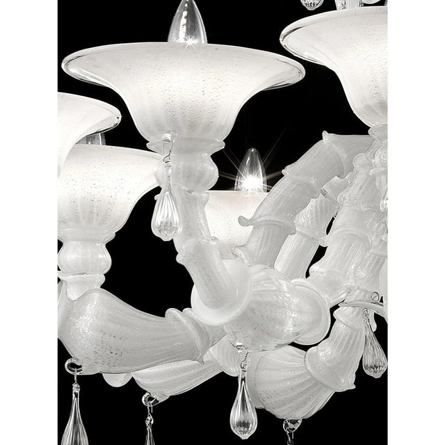 Contemporary Lively white “Cà Rezzonico” Murano Glass Chandelier. The arms are working in traditional working “Cà...