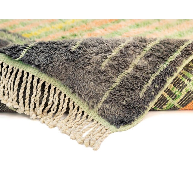 Exquisite hand-knotted rug, captivating with its vibrant pattern, harmoniously blending shades of Chartreuse Yellow,...