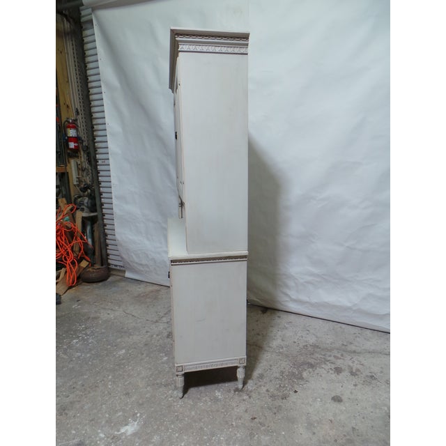 This is a very unique Swedish Gustavian 4 door Cabinet. its been restored and repainted with Milk paints "Oyster White"