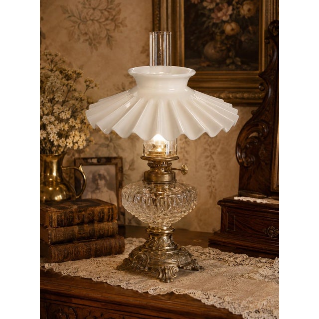 Charming early 20th-century white milk glass petticoat lamp shade featuring a dramatically fluted and pleated profile with...