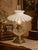 Charming early 20th-century white milk glass petticoat lamp shade featuring a dramatically fluted and pleated profile with...