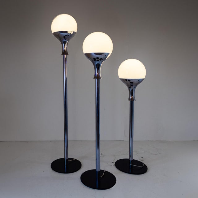 Set of three vintage floor lamps, Italy, 1970s in the style of Artemide. A beautiful and unique trio of three space age...