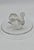 Lalique ring holder in molded pressed white crystal with a satin and polished finish, depicting a swan on a circular base....