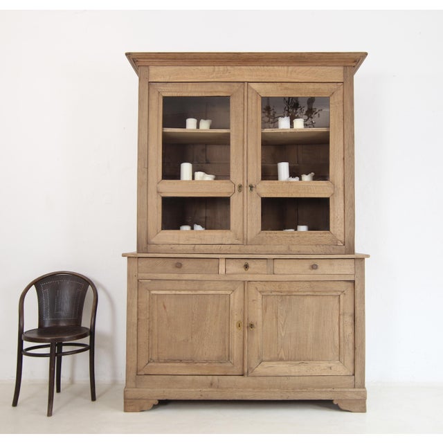 Late 19th century buffet or display cabinet. Crafted from solid oak. Ready for everyday use. Two-part oak body with...