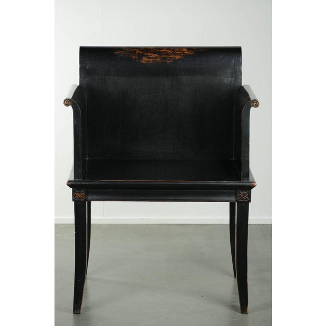 This wide, black wooden chair—or accent chair—in Asian style dates from the 20th century and features elegant wood...