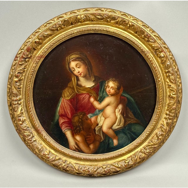 Oil on wood in tondo format, the Virgin with the Infant Jesus and Saint John the Baptist, presented in its original 18th-...