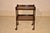 Edwardian oak bar cart from England, circa 1900. This cart has two shelves, both with galleries on three sides. The...