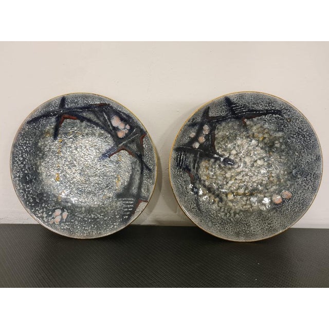 Pair of plates produced by Studio Del Campo. Two plates made of high-fire enamelled copper. The objects produced by the...