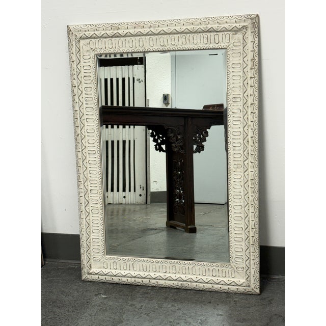 Design Plus Gallery presents an Embossed Geometric Pattern Wall Mirror. Showcasing an off-white frame with distressed...