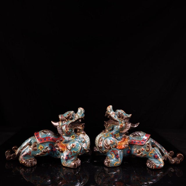 This charming pair of vintage cloisonne enamel guardian lions, or Foo Dogs, brings a touch of traditional elegance to any...