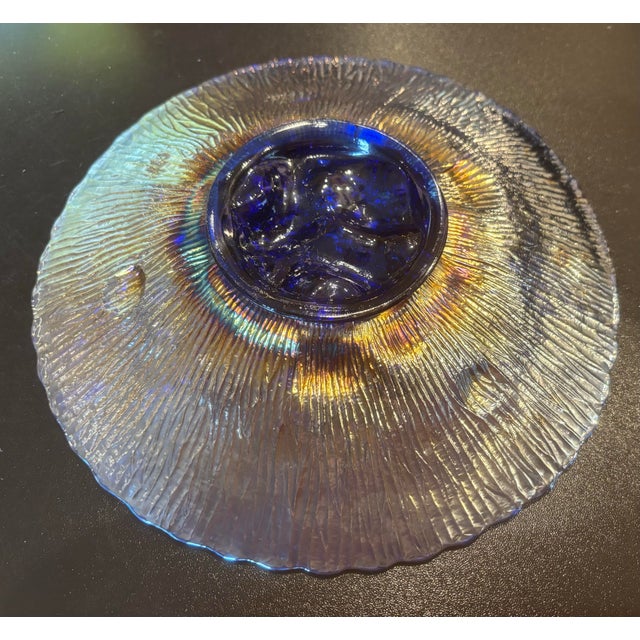 This is a beautiful iridescent, electric blue plates made by Northwood in the Poppy Show pattern. it is about 9 1/4 inches...