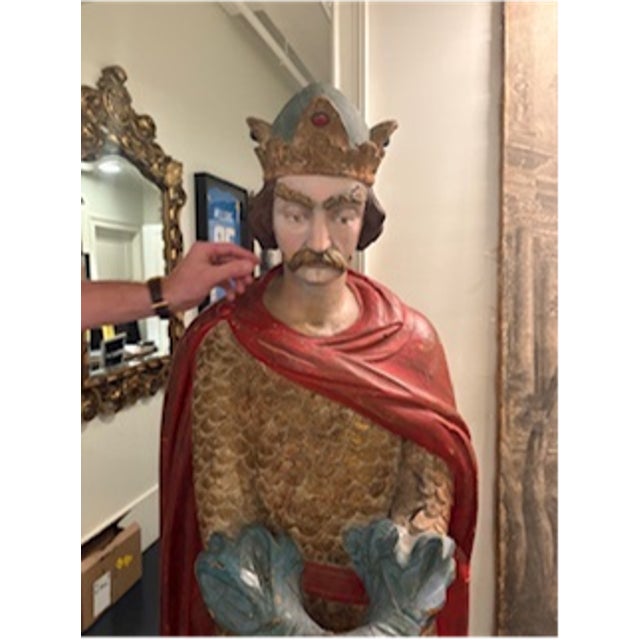Bring a sense of history and heroic presence to your space with this life-size antique carved wooden knight statue....