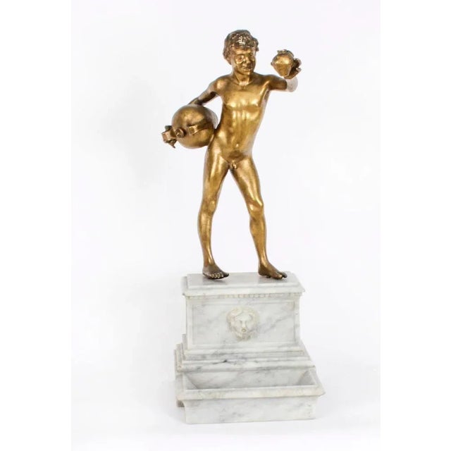 This is a striking large antique gilt bronze figural sculpture titled "The Water Carrier" (L'acquaiolo) by Vincenzo...