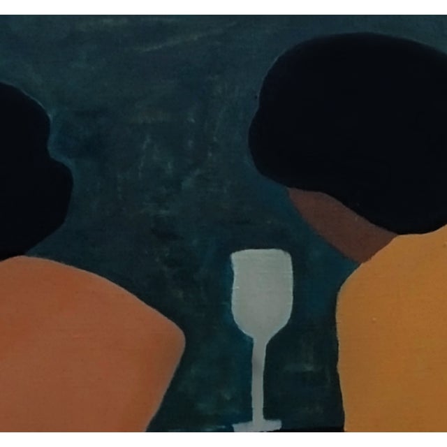 In the warmth of friendship, two women sit together, a bottle of wine between them, sharing stories that weave their lives...