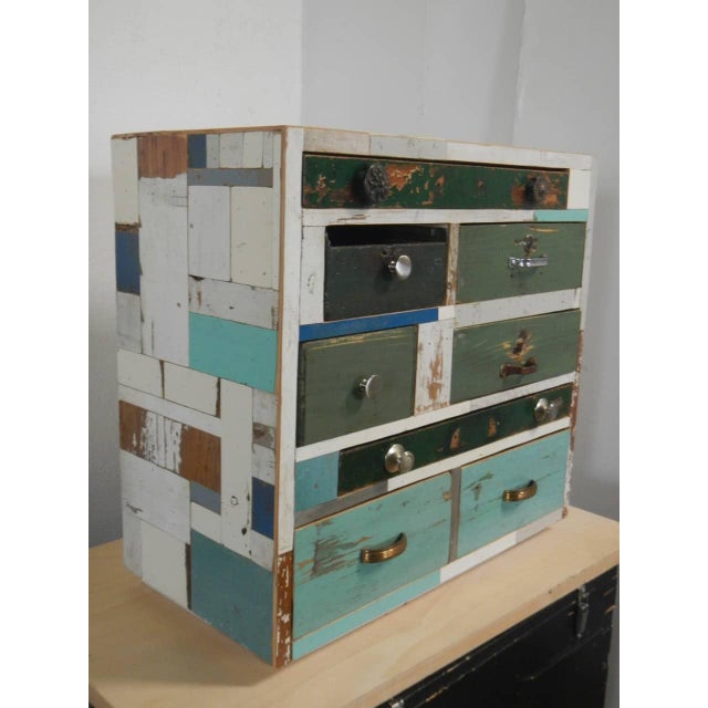 Made of fir wood and lined with reclaimed wood. It features 8 drawers of various sizes. Original iron and aluminum...