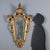 Carved and gilded wood mirror from late 18th century Italy, distinguished by an elegant frame decorated with floral,...