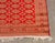Persian Bokhara Silk and Wool Rug, on red ground with repeating geometric pattern. 6' 5" L x 4' 6" W. Provenance: From an...