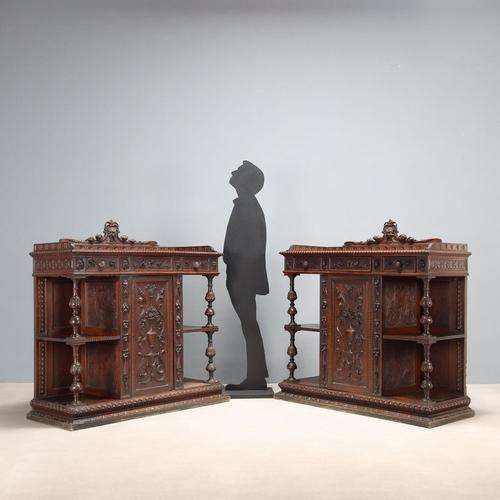 Pair of Neo-Baroque sideboards. Three drawers in the lower section with floral, leaf, and fruit carvings; the two side...