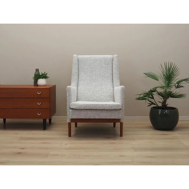 The armchair was made in the 1960s, Danish production. The structure is made of solid wood. Legs made of beech wood. Wood...