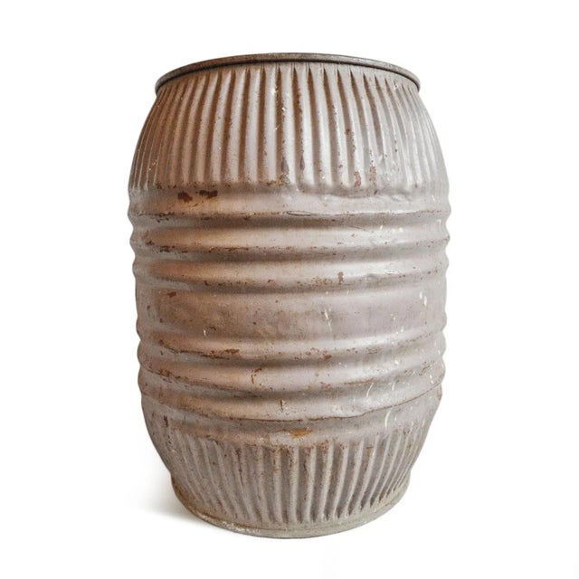 Vintage iron grain barrel from India. Solid iron with ribbed form and original painted worn finish with beautiful...