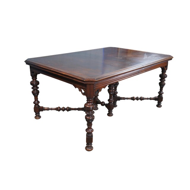 Antique Orinoco Furniture Company Jacobean / Spanish Revival style extendable dining table. Made of oak featuring...