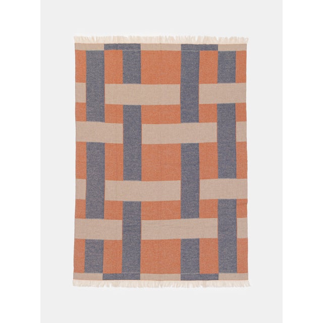 Cashmere and wool blanket with woven pattern.