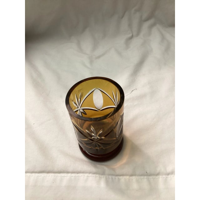 This Amber cut-to-clear double old fashioned low ball glass is characterized by its amber color and intricate cut...