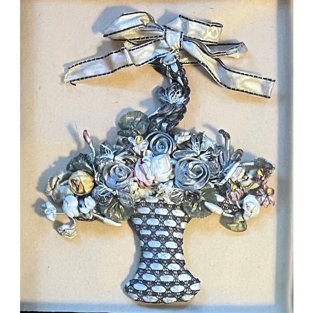 Antique 19th century shadow box containing a flower basket made entirely of silk ribbons. Measures 9 1/2" x 8 1/4" x 1...