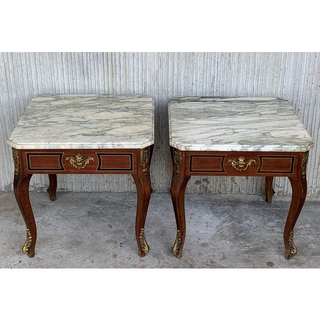 About This Louis XV style square tables with marble tops are made of walnut, with four tapered legs each table. The pieces...