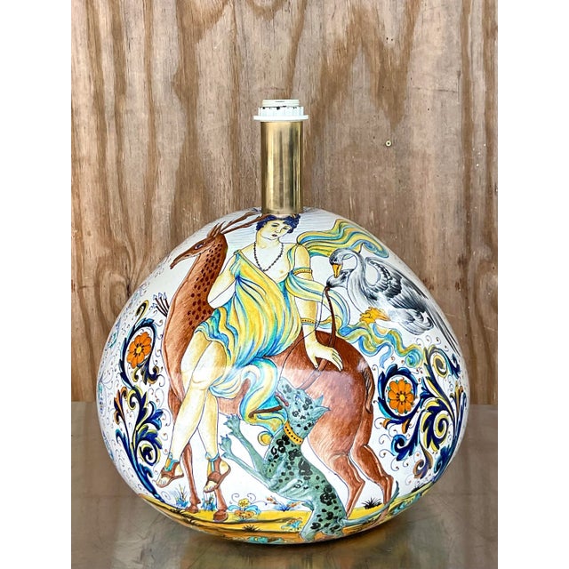 An exceptional vintage hand-painted Italian Majolica ceramic table lamp, exquisitely decorated with a romantic...