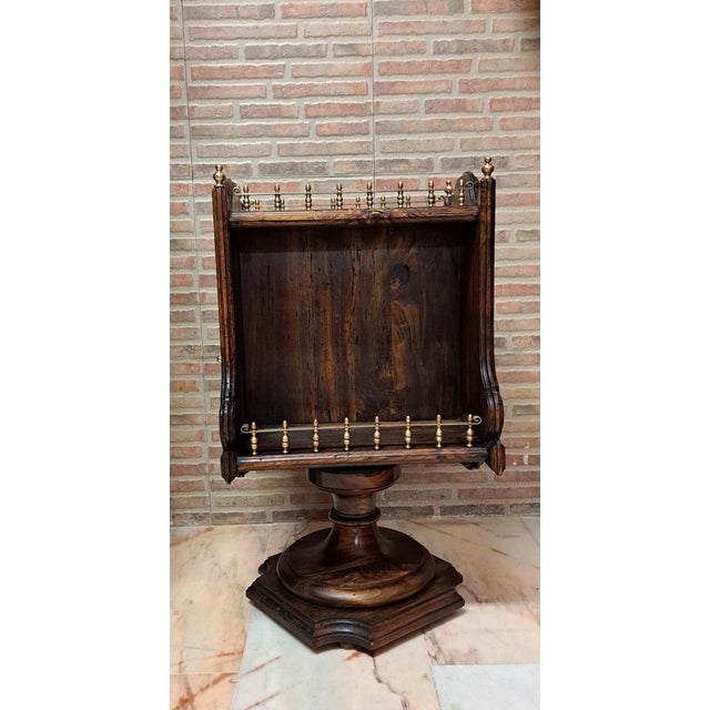 A nautical-style rotating bar table from the early 20th century, of Italian origin. Made of olive wood with brass...