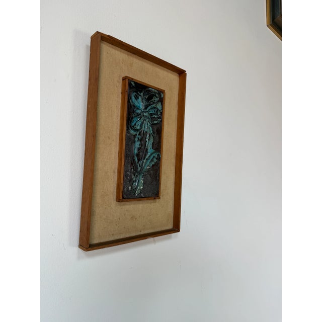 Striking and full of organic texture, this 1970’s Mid-Century Art Ceramic Wall Plaque features a sculpted floral relief...