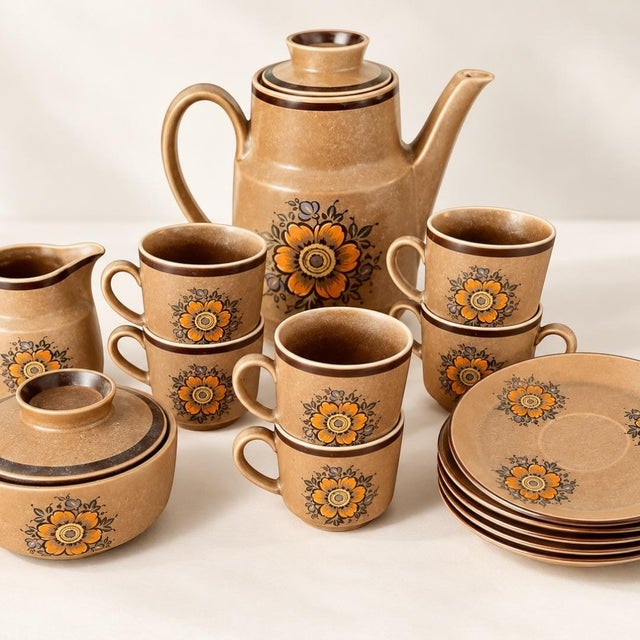 Charming vintage ceramic coffee service dating from the late 1960s to early 1970s, featuring a warm beige and brown glaze...