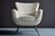 Elegant 1950s lounge chair designed by Henry Glass, featuring a sculptural upholstered form with distinctive angled...