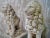 A pair of two concrete stone lions. A wonderful way to add a regal look to an entryway. Each lion sits on its hind legs,...