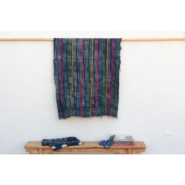 A masterwork of Malian textile heritage featuring deep indigo saturation and symbolic geometric motifs. Originating from...
