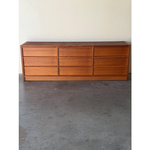 Authentic Mid-Century Modern Danish teak long dresser. This beautifully proportioned 9-drawer dresser features clean,...