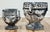 Vintage pair of white washed concrete planters. Urn shape with a Greek key pattern to top of each planter and grape design...