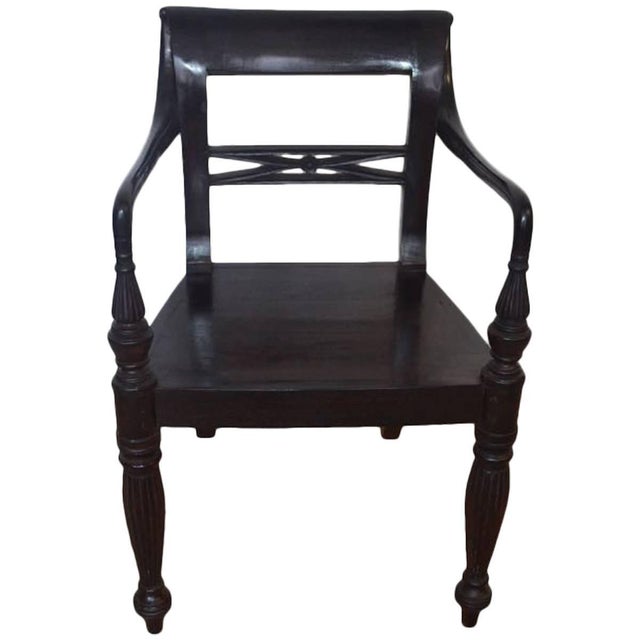 This beautiful Colonial chair is hand-carved from reclaimed teak wood. We found an antique chair and reproduced a small...