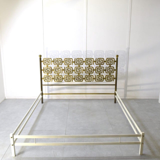 This bed is crafted from hand-cast brass (or bronze). The metal has a warm, rich golden hue. The aesthetic is typical of...