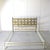 This bed is crafted from hand-cast brass (or bronze). The metal has a warm, rich golden hue. The aesthetic is typical of...