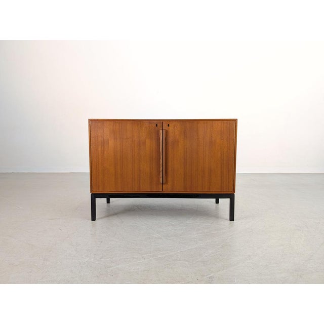 A beautiful teak sideboard from the renowned Danish manufacturer Atlas & Silkeborg Møbelfabrik. Designed by Sigvard...
